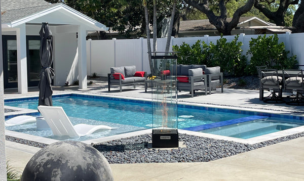 Torrent column mounted torch against Southern California skyline 