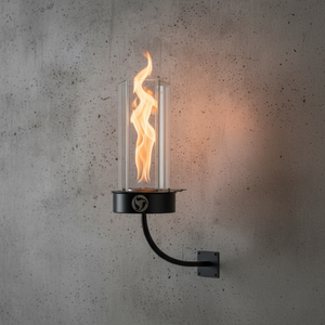 Wall-mounted fire lantern with flames against a concrete wall