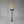 Black outdoor fire torch with flames on a gray concrete background