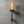 Wall-mounted torch with flames against a concrete wall
