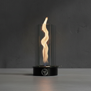 Modern table-top fireplace with wavy flame design on a dark background
