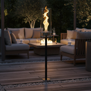 Outdoor patio with fire pit table and seating area at dusk