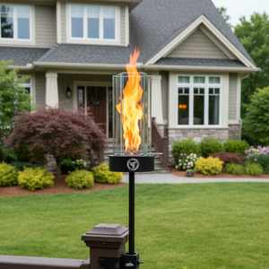 Outdoor fire pit on a deck with a house in the background