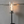 Outdoor fire lantern with flame on a concrete wall background