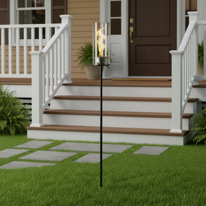 Outdoor fire pit on a patio with a house in the background