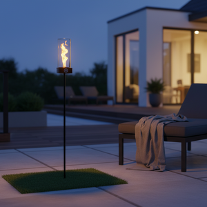 Outdoor patio scene with a lit garden torch, modern furniture, and a house in the background.