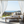 Modern table lamp with glass shade and visible flame on a neutral background