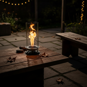 Modern table lamp with glass shade and visible flame on a neutral background