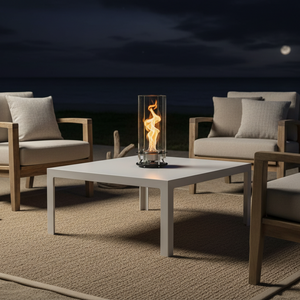 Modern table lamp with glass shade and visible flame on a neutral background