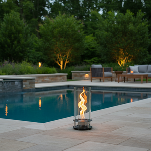 Modern table lamp with glass shade and visible flame on a neutral background 