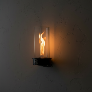 Wall-mounted fire pit with flames on a dark wall