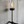 Wall-mounted torch with flame against a concrete wall