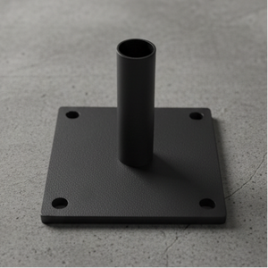 Black metal bracket on a gray concrete surface