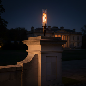 Vortek post mount fire feature designed for column and post installations, featuring a tall vortex flame and clear glass wind guard for luxury outdoor patios and commercial landscapes