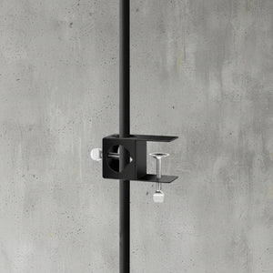 Black wall-mounted shower fixture on a white background