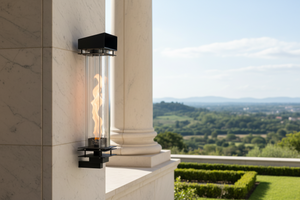 Wall-mounted outdoor fireplace with scenic view of greenery and sky