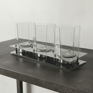Glass display case with three compartments on a white background