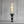 Modern outdoor torch with flames on a concrete surface and wall background