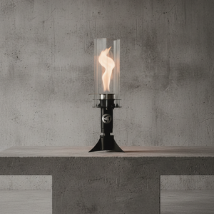 Modern outdoor lamp on a concrete surface with a concrete wall background