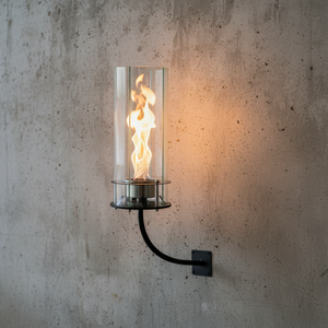 Wall-mounted fire pit with flames on a concrete wall