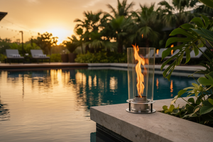 Modern outdoor fireplace with flames on a concrete surface and gray background