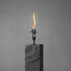 Post mounted vortex fire torch for column and pillar installations, featuring a tall vortex flame, clear glass wind guard, and black powder-coated body, compatible with natural gas or propane for luxury outdoor patios and commercial landscapes